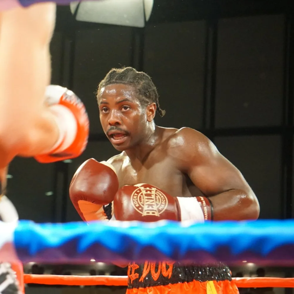 John ‘The Dog’ Dagrin in the ring during a fight, ‘The Dog’ on his shorts