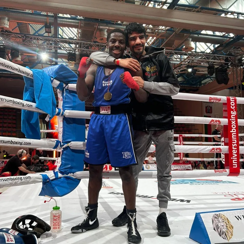 John ‘The Dog’ Dagrin celebrating a win with his coach
